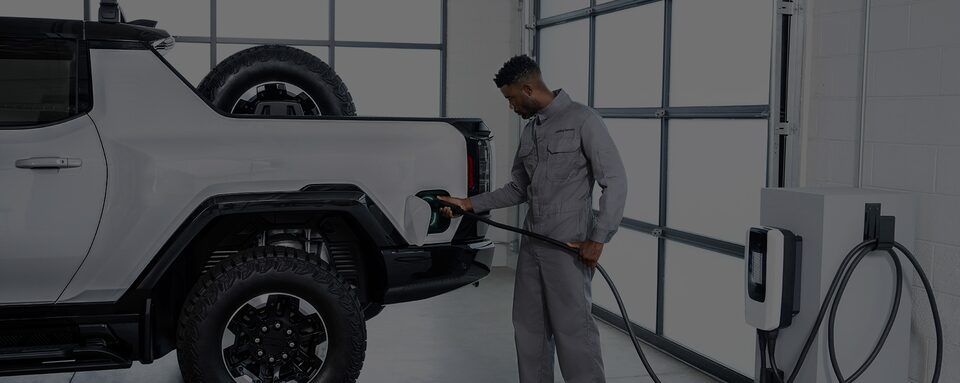 A Certified Service technician charging an EV