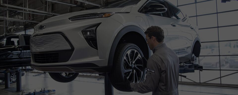 A Certified Service technician changing a tire