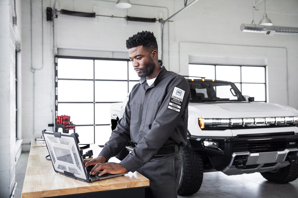 Certified Service technician performing timely updates on a laptop