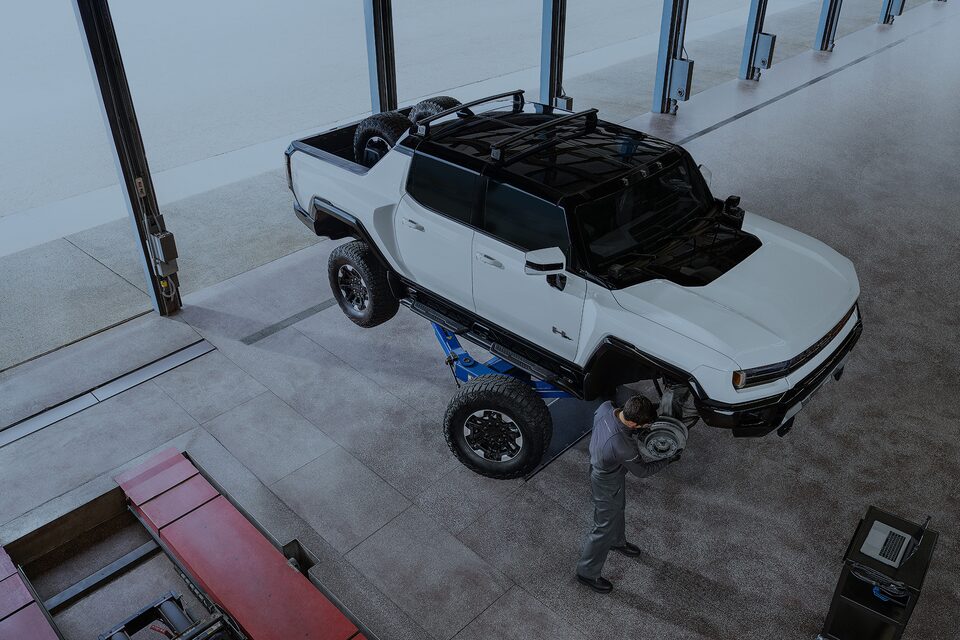 Certified Service technician changing the wheels of an EV