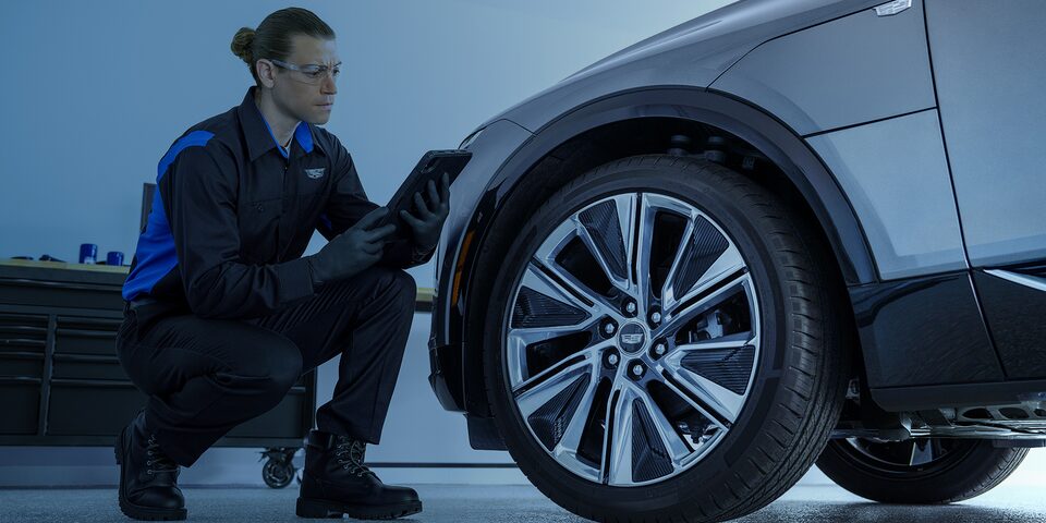 Certified Service technician working on an EV