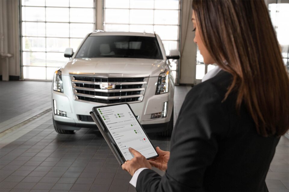 Certified Service advisor performing a Vehicle Health Check.