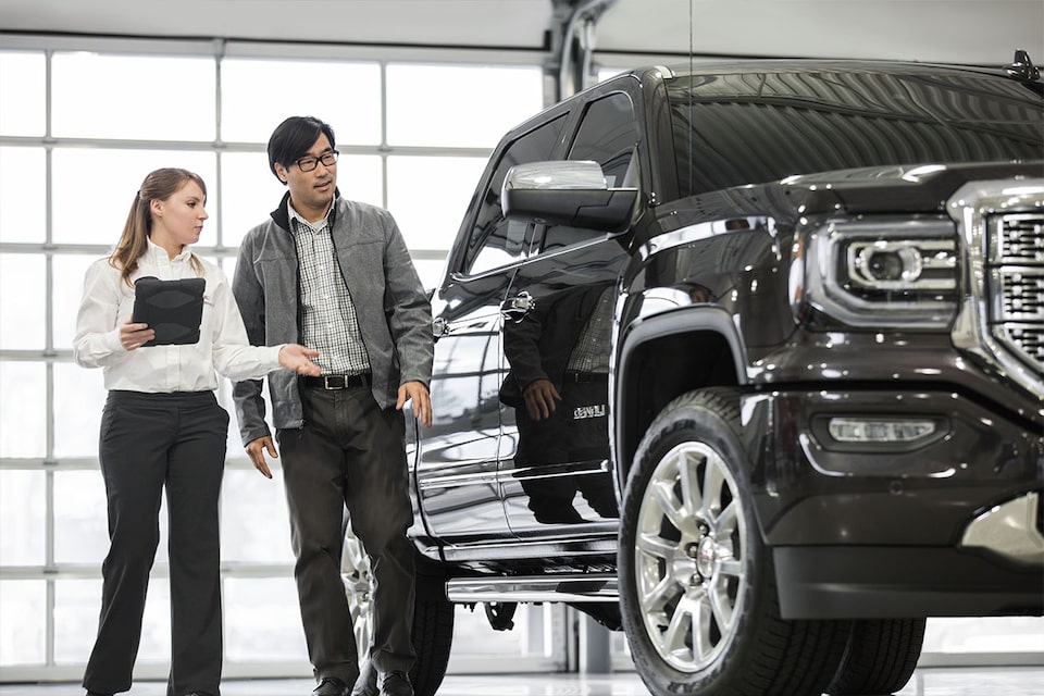 Certified Service representative discussing with an owner a comprehensive assessment of his truck including a Full Synthetic oil change