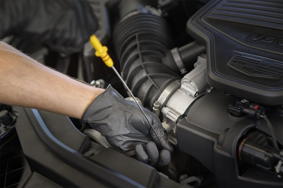 Certified Service technician working on an engine with Mobil 1™ motor oil