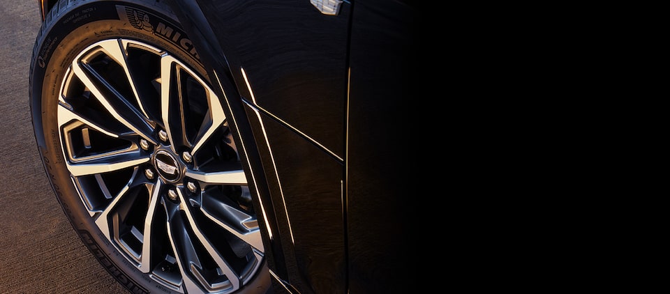 A Chevrolet Equinox covered by the GM Tire Protection Plan driving alone on a bridge.