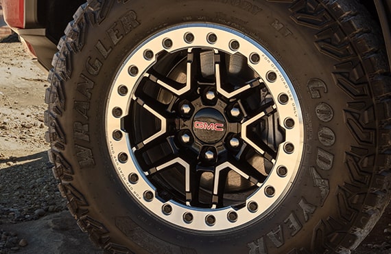 Poster about GM's Tire, Wheel and Cosmetic Protection Plan.