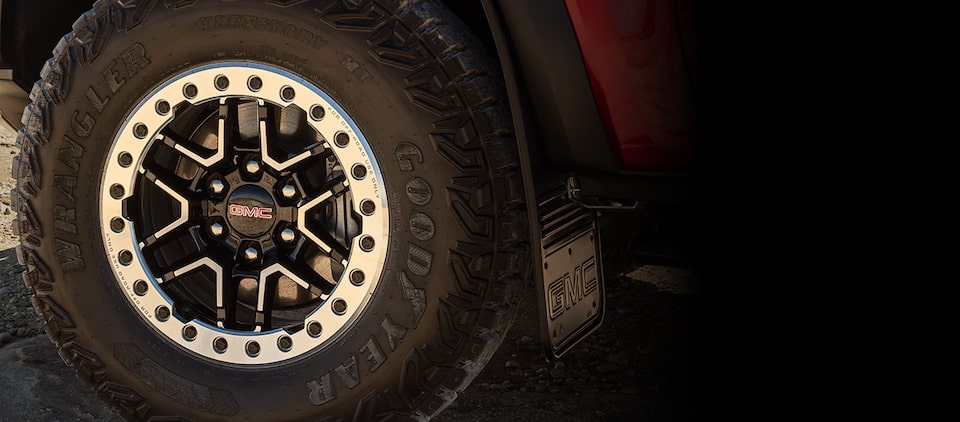 Poster about GM's Tire, Wheel and Cosmetic Protection Plan.
