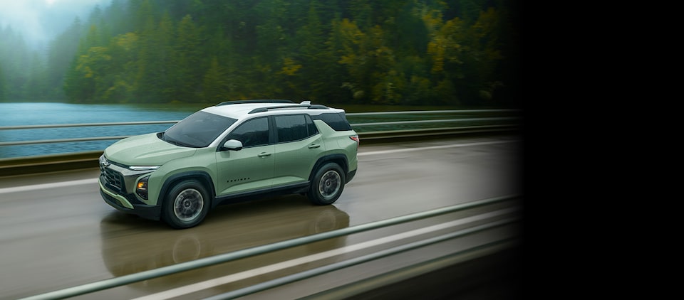 A Chevrolet Equinox covered by the GM Tire Protection Plan driving alone on a bridge.